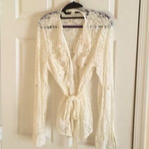 White lace blouse with button down front and tie belt.